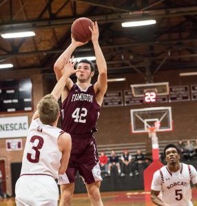Freshman Tyus Ripley puts up a shot at a recent game against Bates College. (Photo by Jeff Lamb Photography)